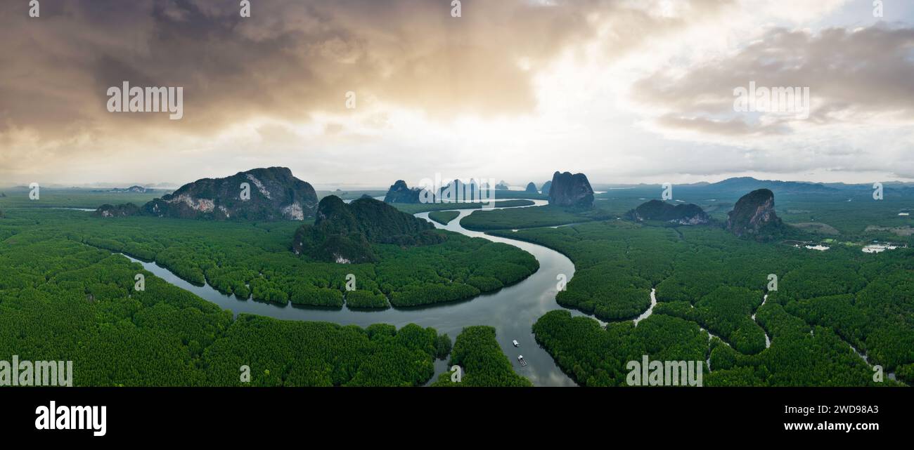 View from above, aerial shot, stunning panoramic view of Ao Phang Nga (Phang Nga Bay) National Park featuring a multitude of limestone formations. Stock Photo