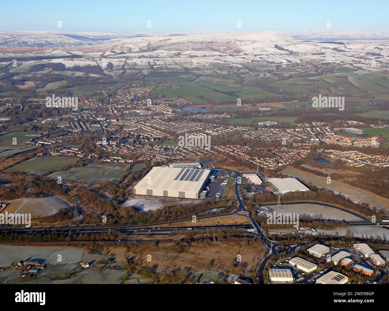 aerial view of the Exertis UK Ltd (logistics company) & the smaller Fagan & Whalley warehouse & other units Stock Photo