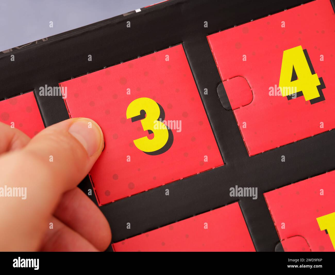 A woman hand opening a door with number 3 on an advent calendar Stock ...