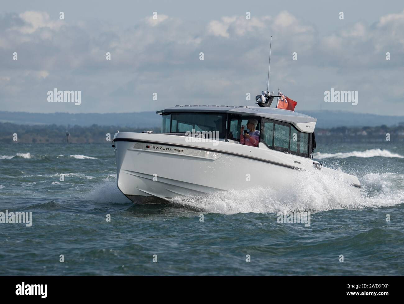 Smart Saxdor 320 GTC speedboat making rapid progress along the Solent during the Cowes Power Boat Race Stock Photo
