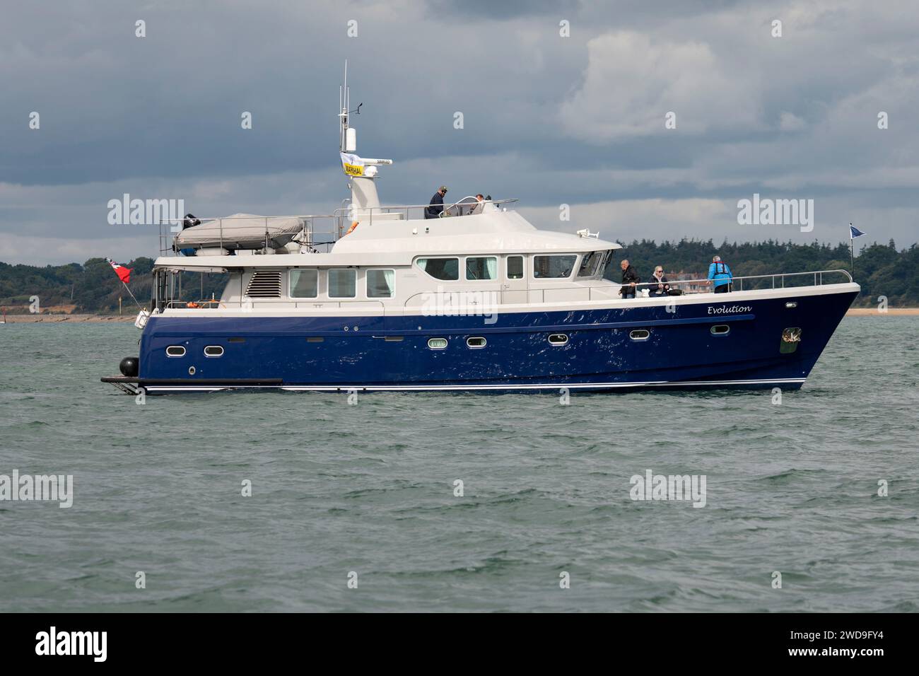 Lovely looking Hardy motor yacht, Evolution acting as a marshal boat during the Cowes Power boat race in the Solent off the South coast of England Stock Photo