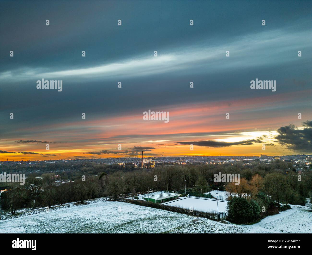 Bolton England UK Friday January 19 2024 Drone Images Of Tonights   Bolton England Uk Friday January 19 2024 Drone Images Of Tonights Fiery Sunset Over A Frozen Leverhulme Park And Showing The Lights Of Bolton Town Centre In The Background Credit Paul Heyesalamy News Live 2WDA0Y7 