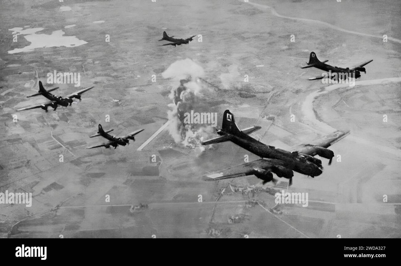 Some of the formation of Boeing B-17 Flying Fortresses above the burning Focke Wulf factory in East Prussia, Germany on 9th October 1943. The Second World War flight involved a 1,800 mile round trip and took about 10 hours. Stock Photo