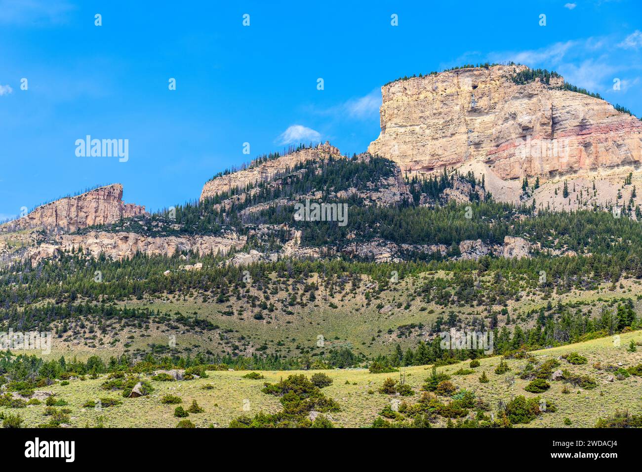 Twin Buttes, Bighorn National Forest in Wyoming, is seen from Bighorn Scenic Byway Route 14 near Burgess Junction. This is a beautiful mountain area. Stock Photo