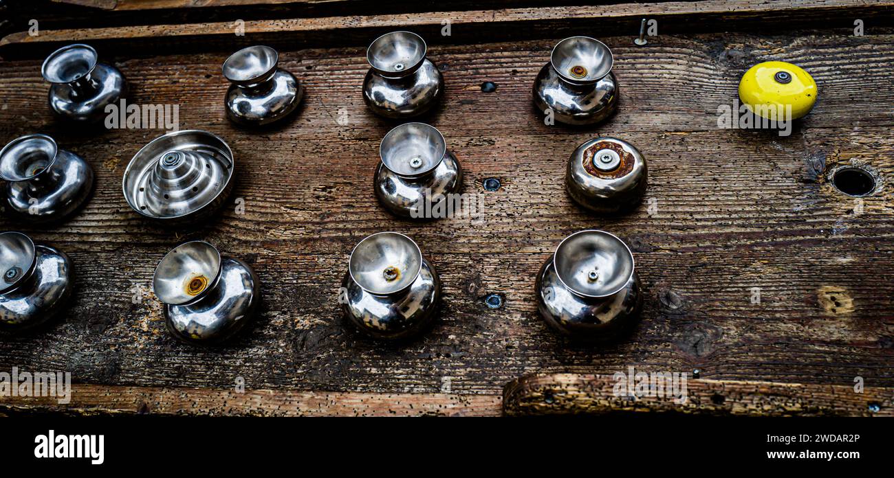 Close-up of a vibrant yellow ball and assorted knobs Stock Photo