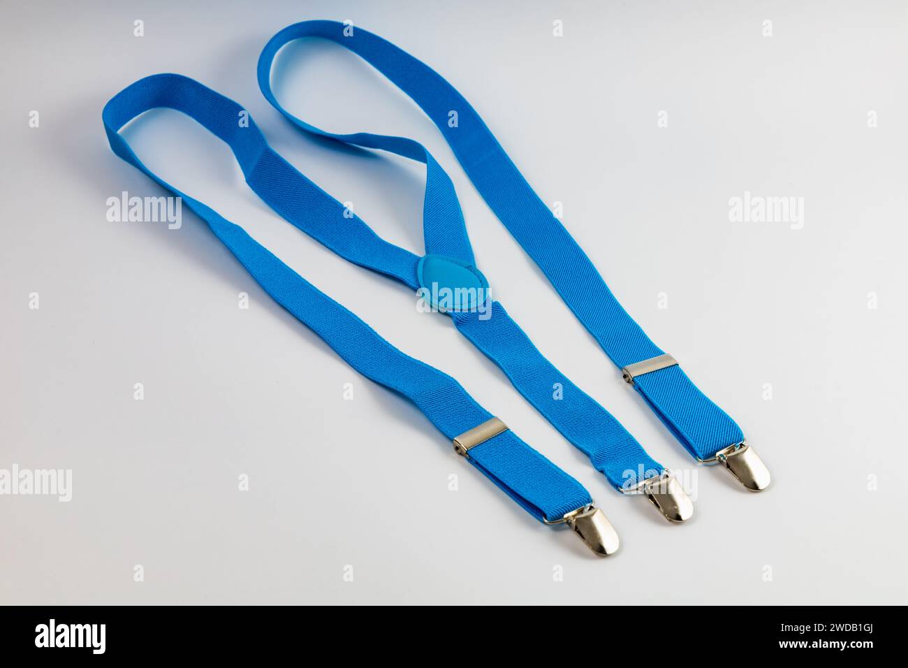 Small and blue trousers suspenders made of elastic fabric Stock Photo