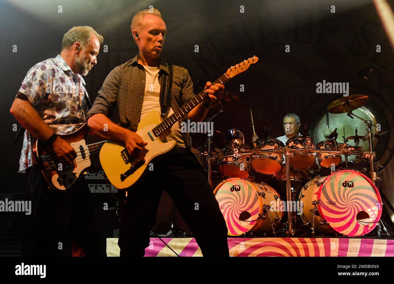 Prague, Czech Republic. 25th July, 2019. ***FILE PHOTO***Guitarist Guy Pratt of Saucerful Of Secrets, the band led by Pink Floyd drummer Nick Mason (right), perform in Lucerna Hall, Prague, Czech Republic, on Thursday, July 25, 2019. On the front there are guitarists Guy Pratt, left, and Gary Kemp. Credit: Vit Simanek/CTK Photo/Alamy Live News Stock Photo
