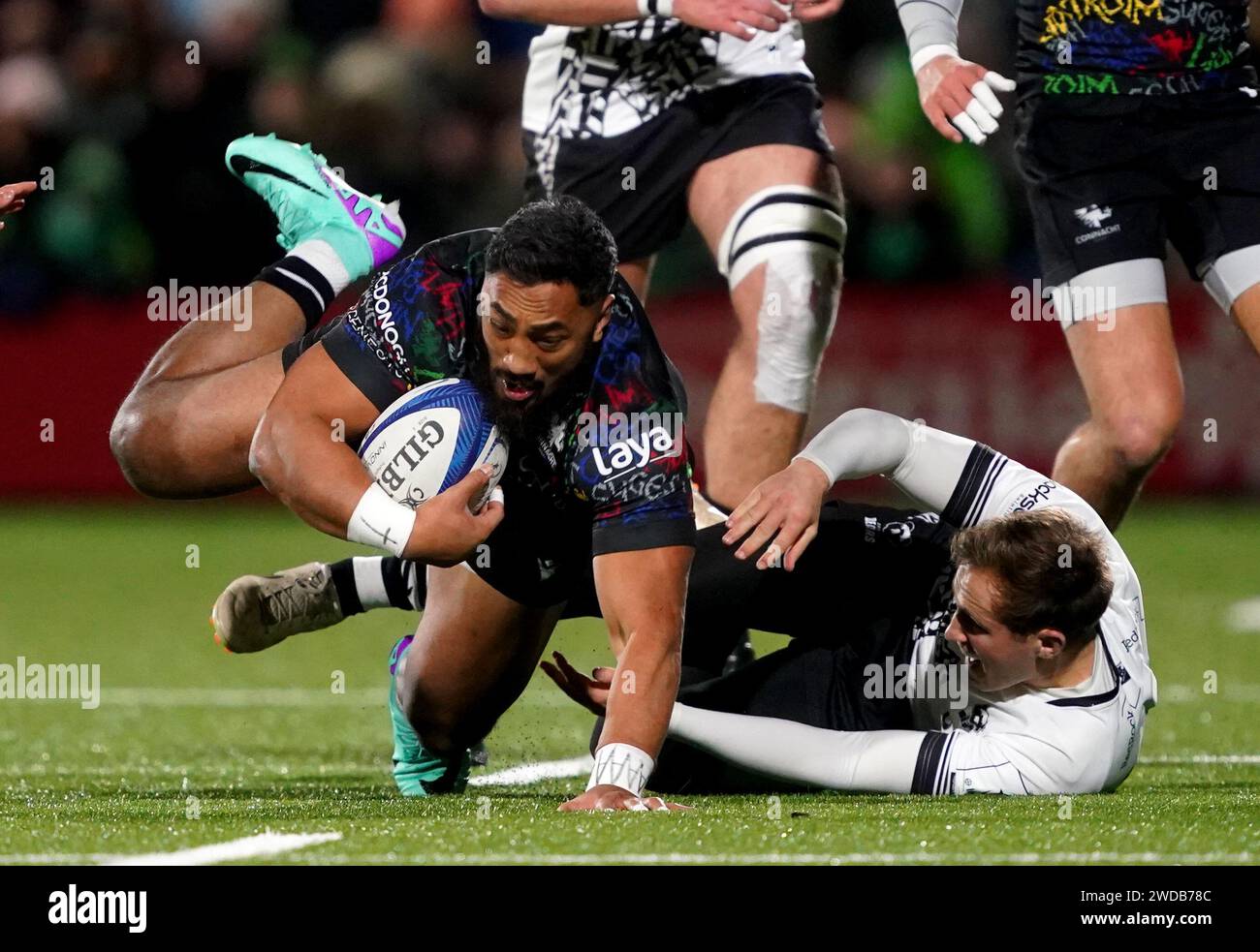 Connacht Rugby's Bundee Aki is tackled by Bristol Bears' Max Malins ...