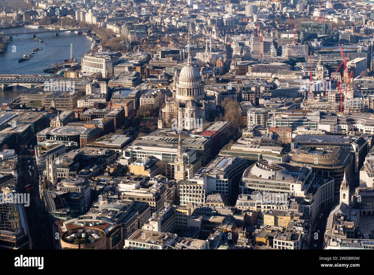 The City of London is a historic financial district. Modern corporate skyscrapers tower above the vestiges of medieval alleyways below Stock Photo