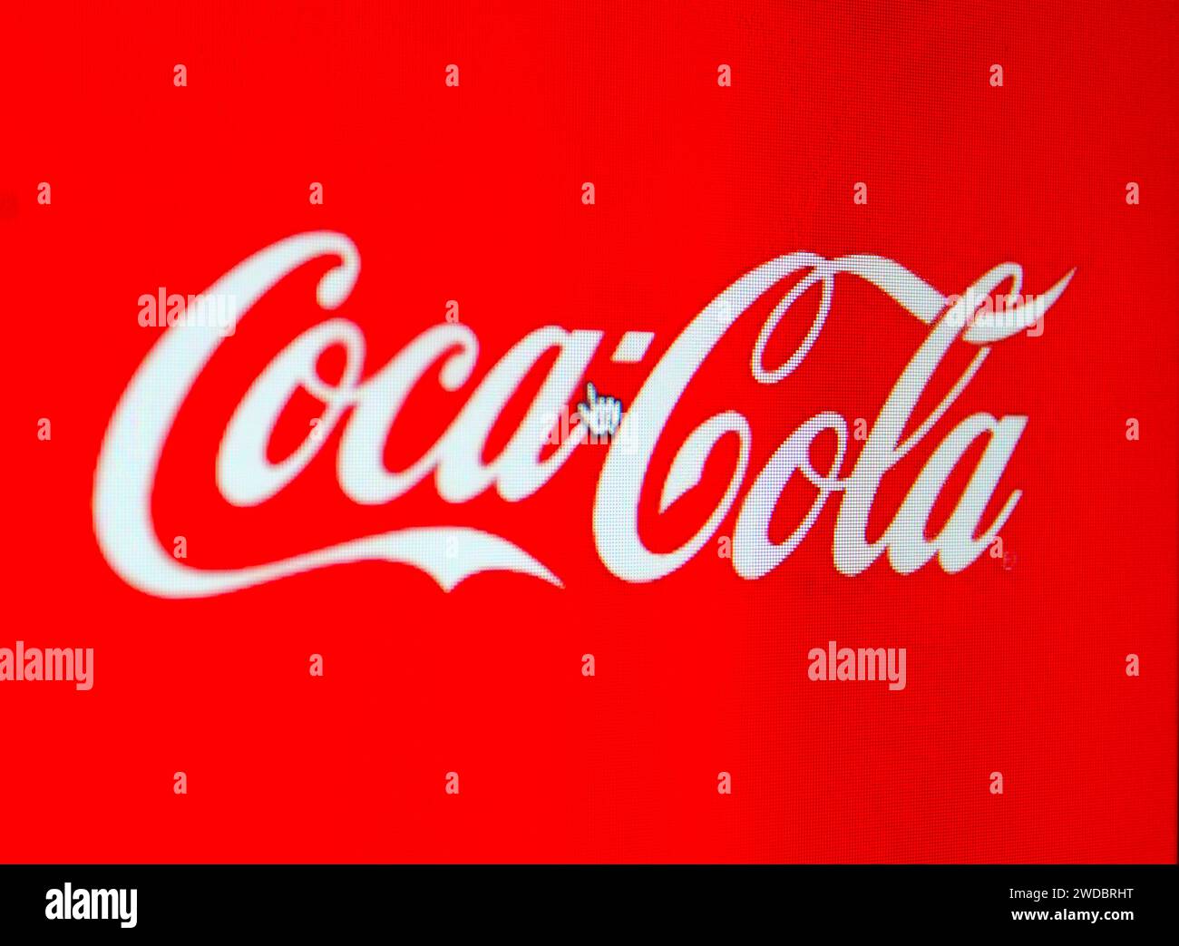 A photo of the Coca Cola logo on a computer screen. Stock Photo