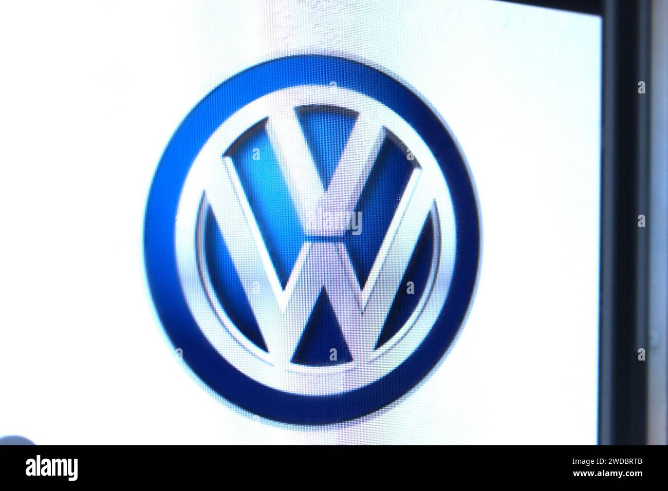 A photo of the Volkswagen car logo on a computer screen. Stock Photo