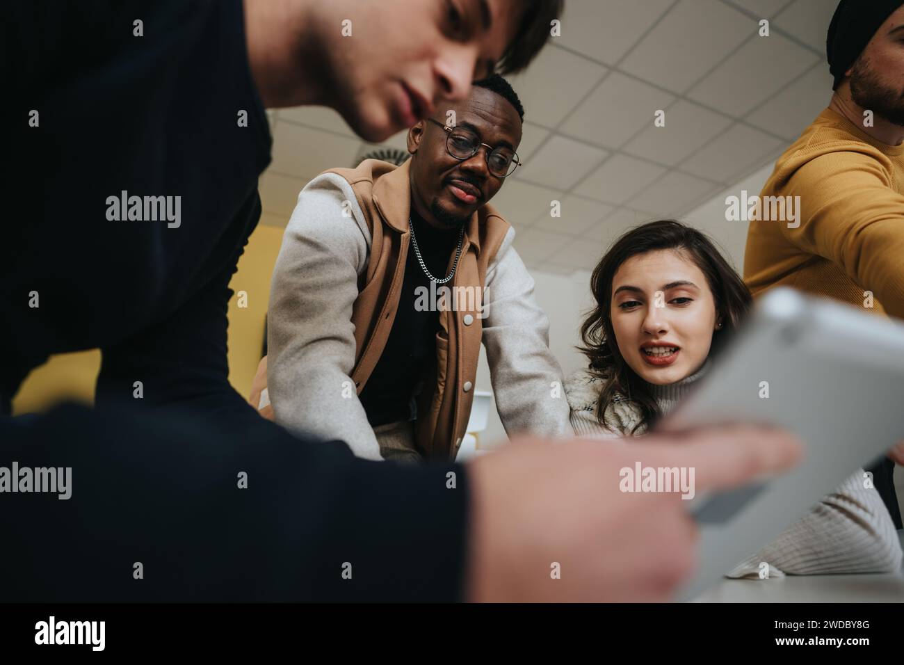 Dynamic corporate team discussing business strategy in a creative ...