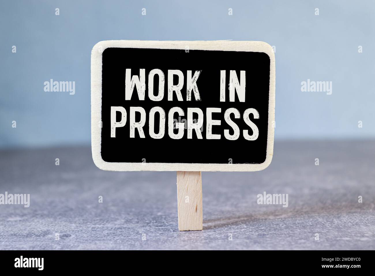 WORK IN PROGRESS text on notebook with chart and calculator Stock Photo ...