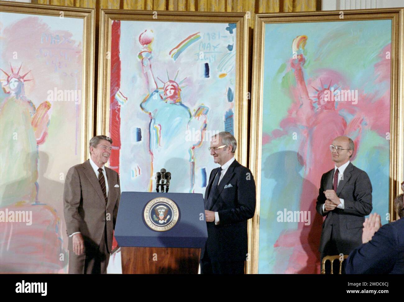 President Ronald Reagan with Lee Iacocca and James Watt. Stock Photo