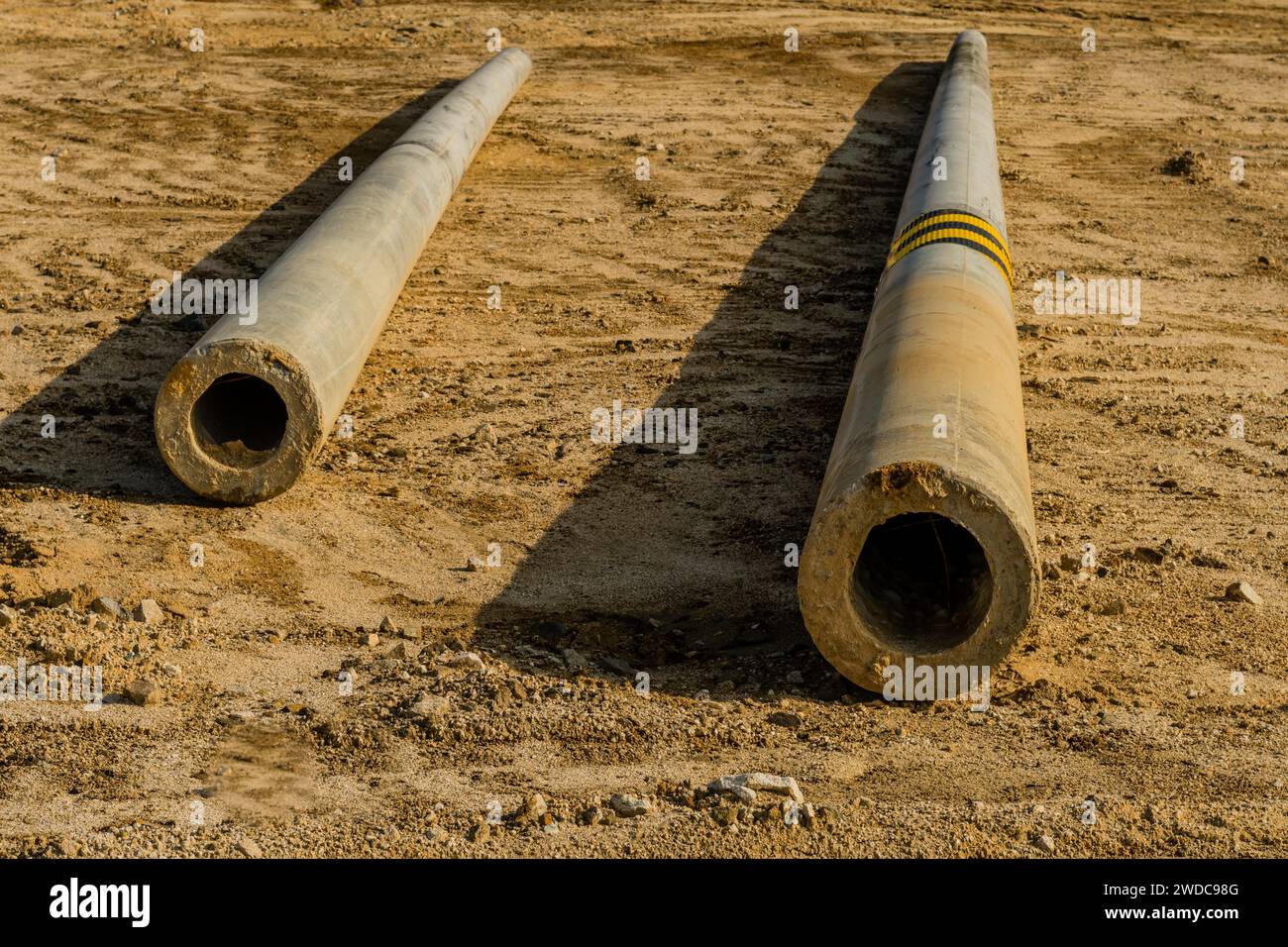 Pole In Ground Concrete utility poles laying on ground at new construction site, South ...