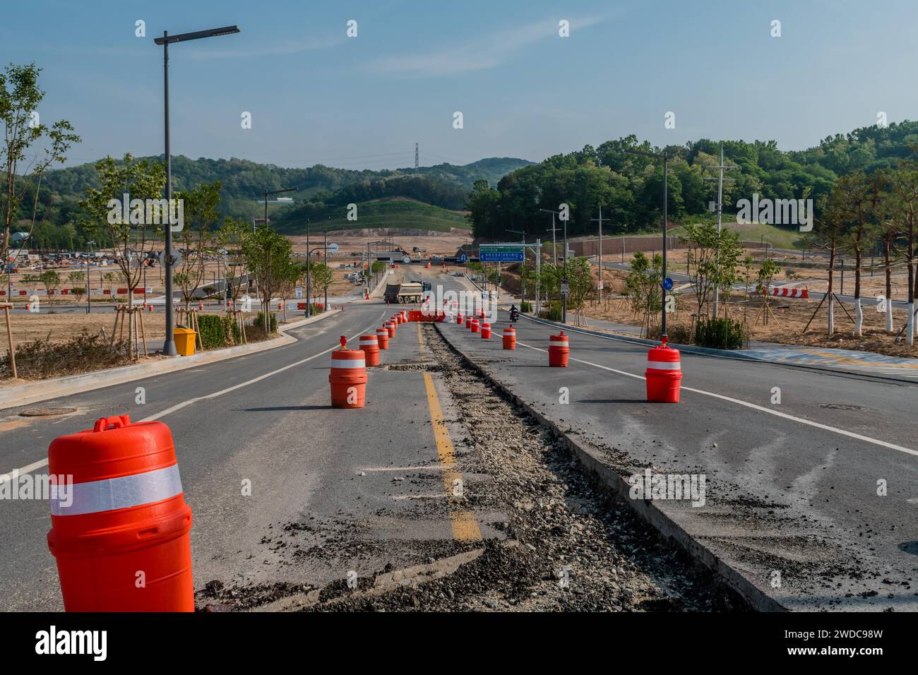 Section of pavement in middle of road removed for installation of