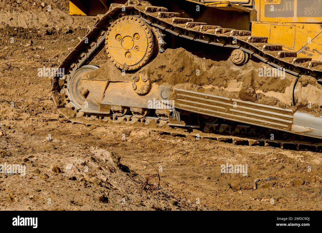 Side rear view of bulldozer tracks sitting at new construction site, South Korea, South Korea Stock Photo