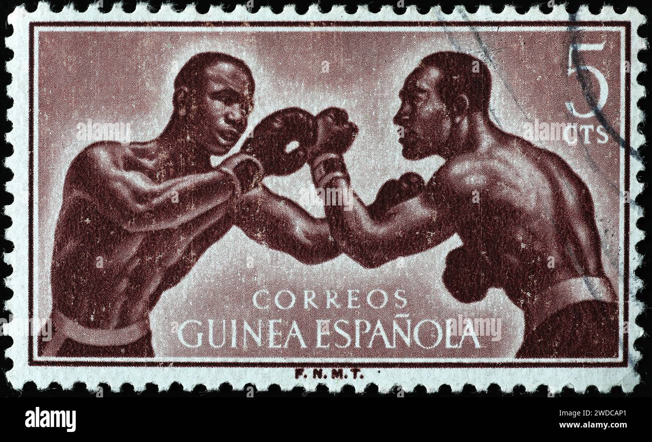 Boxers on vintage postage stamp of Spanish Guinea Stock Photo