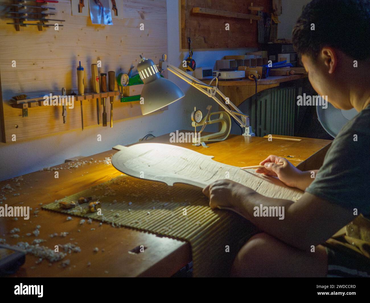 Close up of Stringed instrument maker master luthier hand proceed with