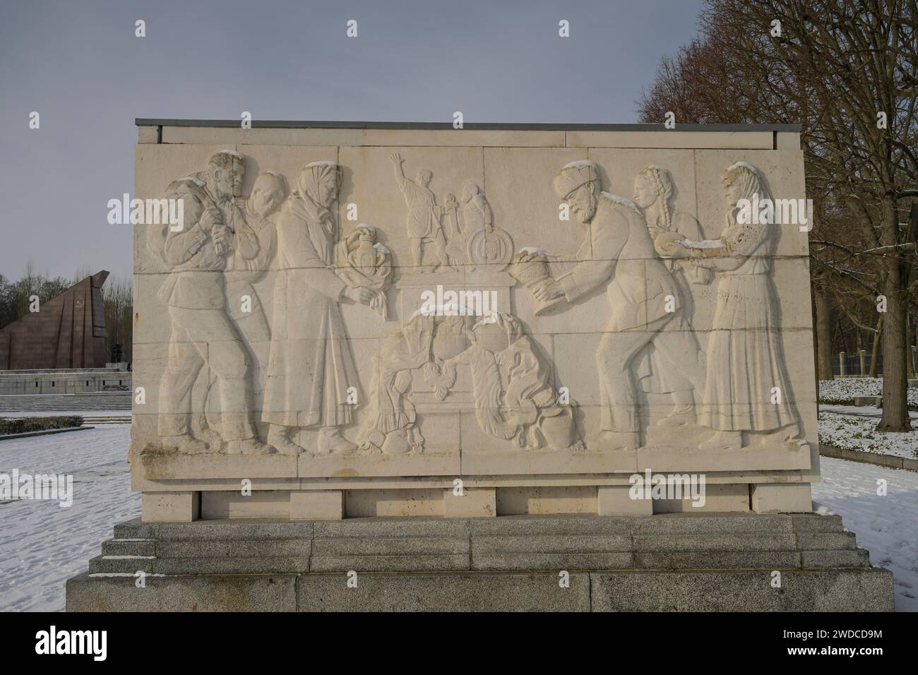 Sarcophagus with stone relief, Theme: Sacrifice and renunciation of the Soviet people and support of the army, Soviet memorial, Winter, Treptower Stock Photo