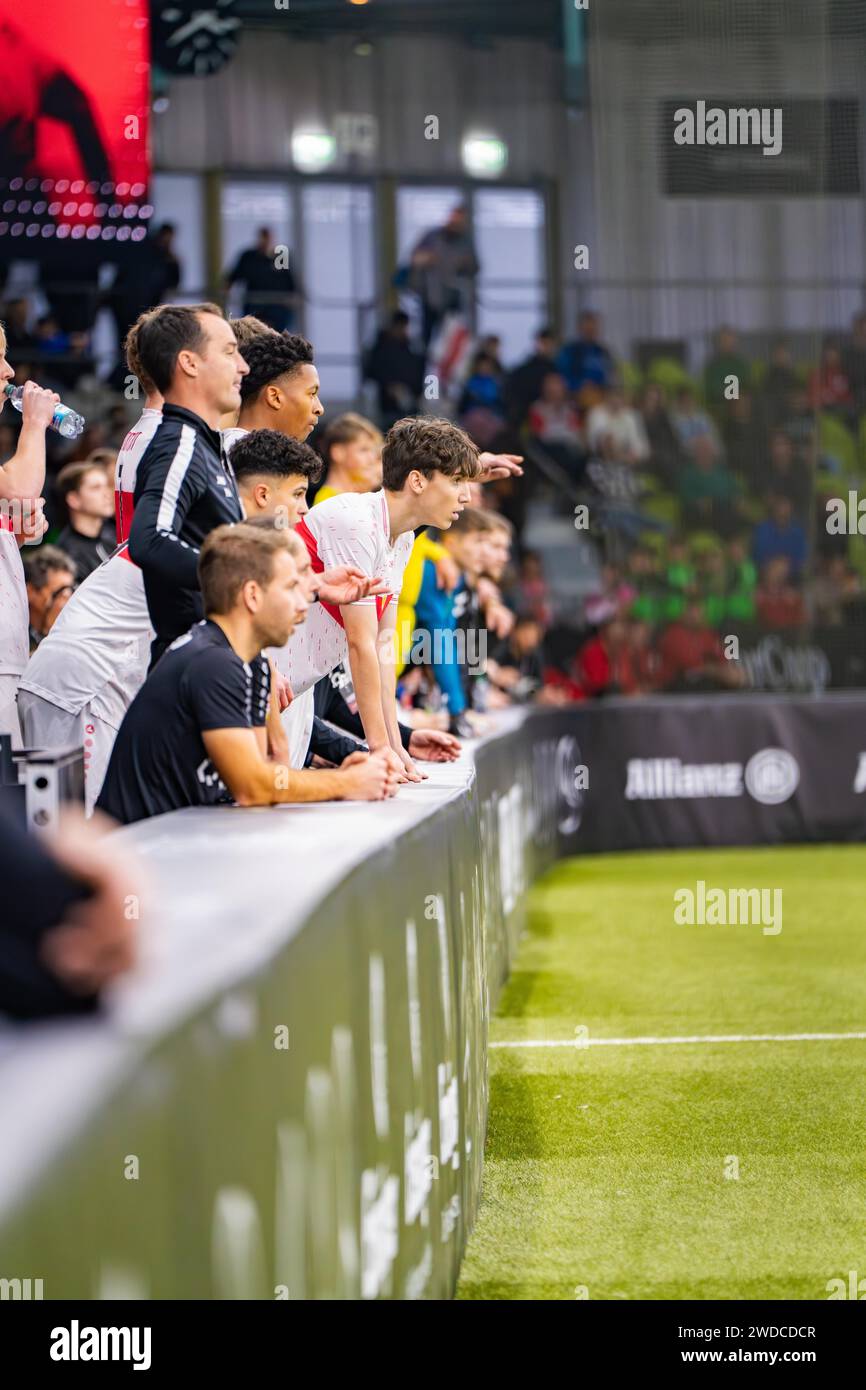 Football players sit on the bench and watch the game, Mercedes Benz Junior Cup, Glaspalast Sindelfingen, Germany Stock Photo