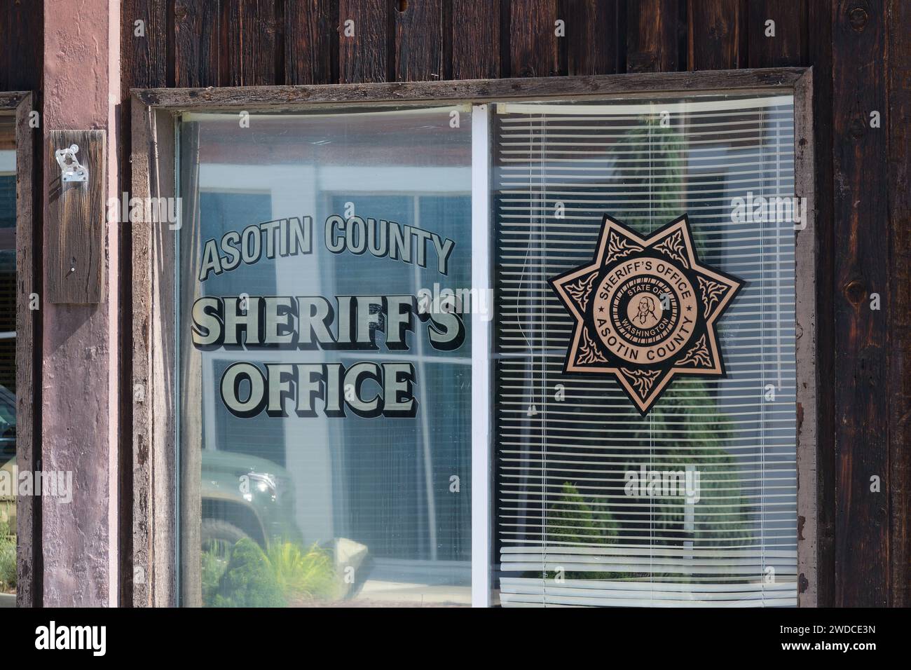 Asotin, WA, USA May 24, 2023; Name and shield on window of Asotin