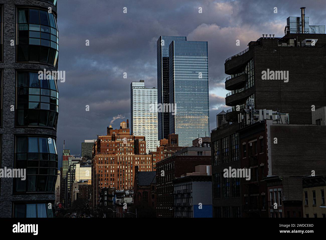Cityscape with dramatic sky, view looking north from Chelsea neighborhood, New York City, New York, USA Stock Photo