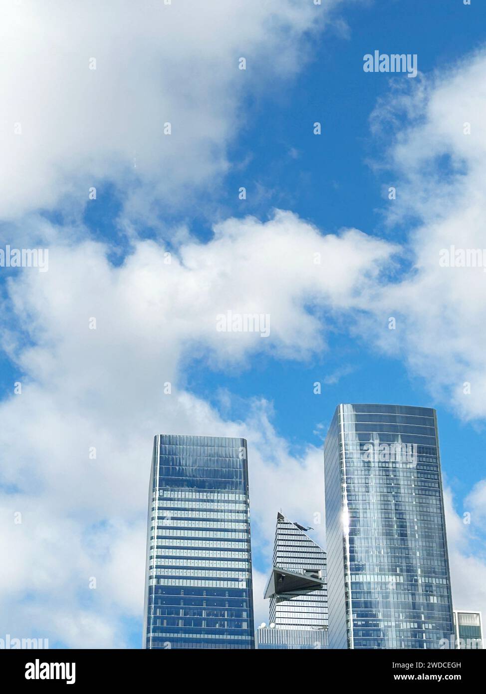 One and Two Manhattan West with 30 Hudson Yards in background against blue sky and clouds, New York City, New York, USA Stock Photo