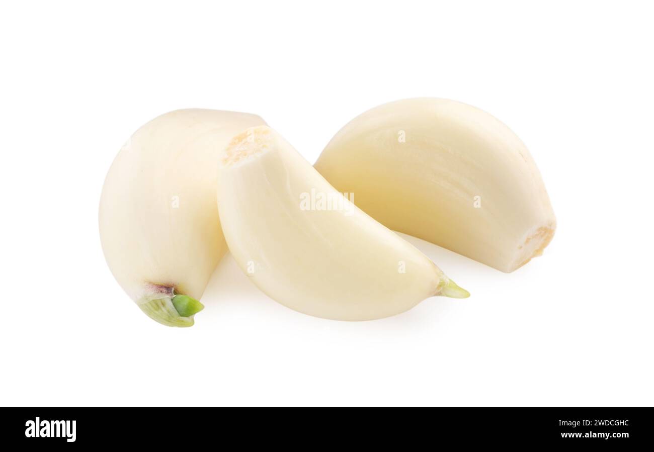 Peeled cloves of garlic isolated on white Stock Photo - Alamy