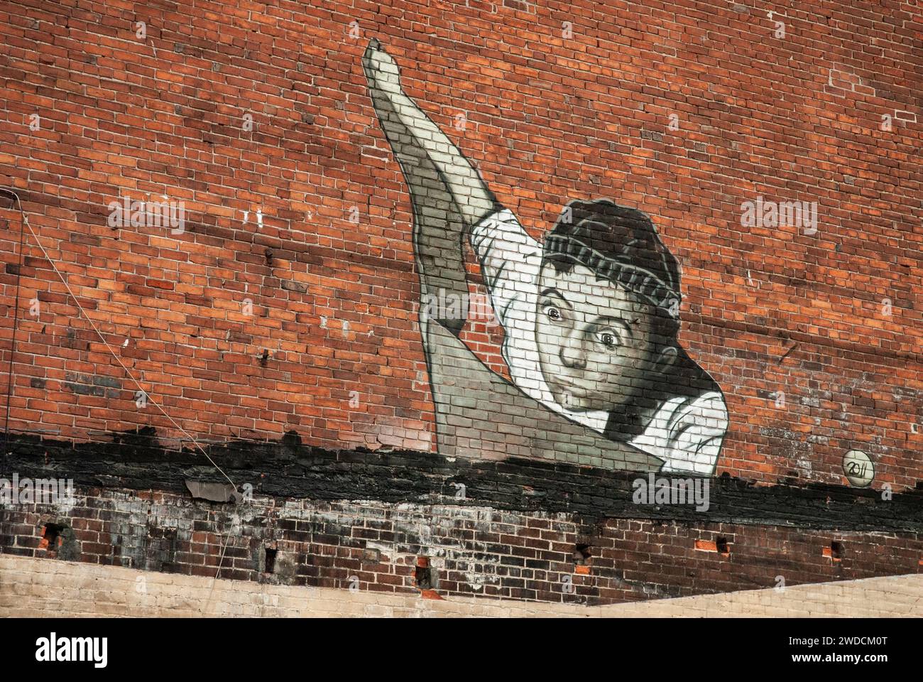 Mural of Aladdin riding a flying carpet on rue de la Commune in downtown Montreal, Quebec, Canada Stock Photo