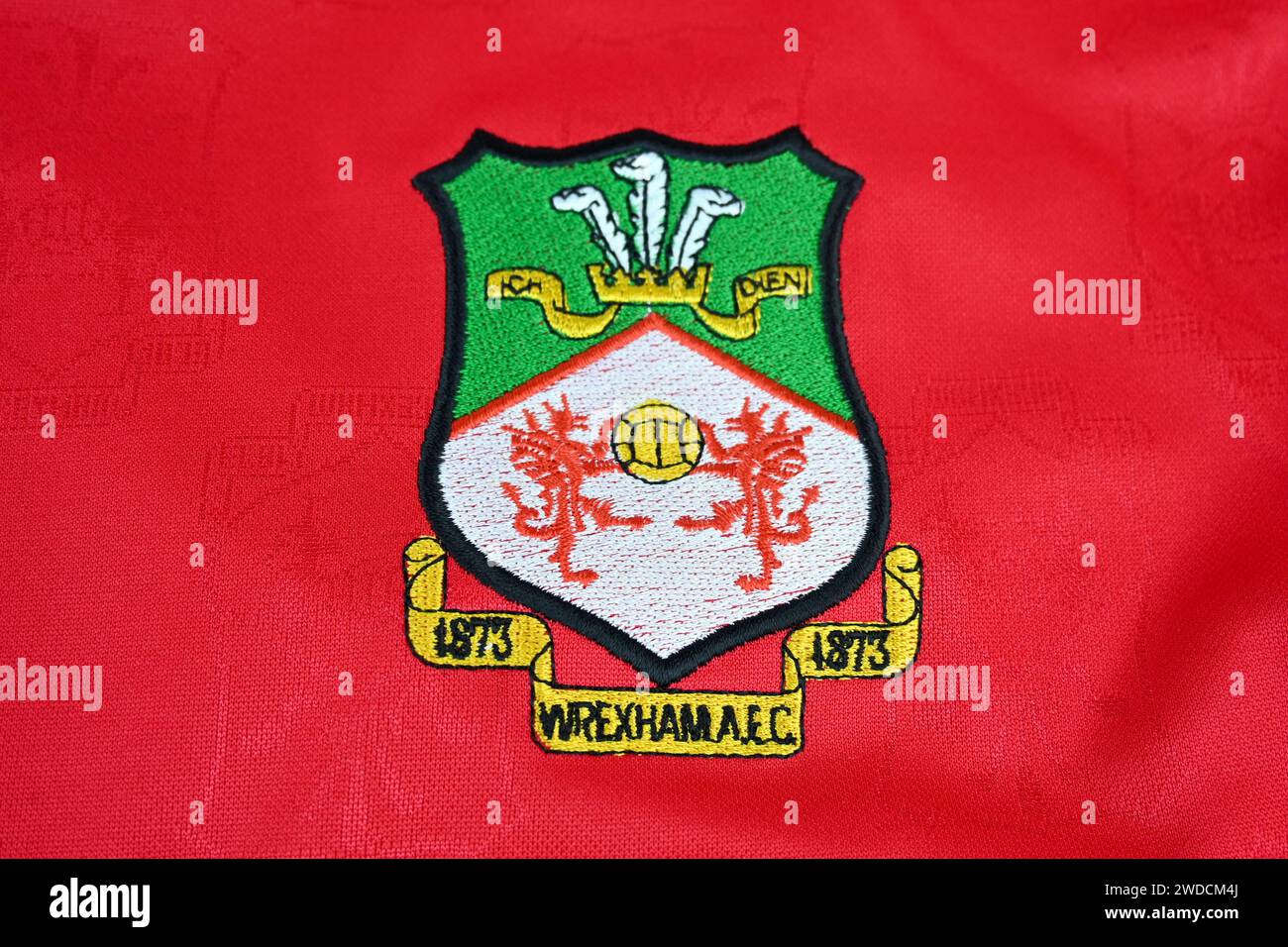 Close up of Wrexham AFC badge on 2001-02 home kit jersey – Wales, UK  –  9 January 2024 Stock Photo