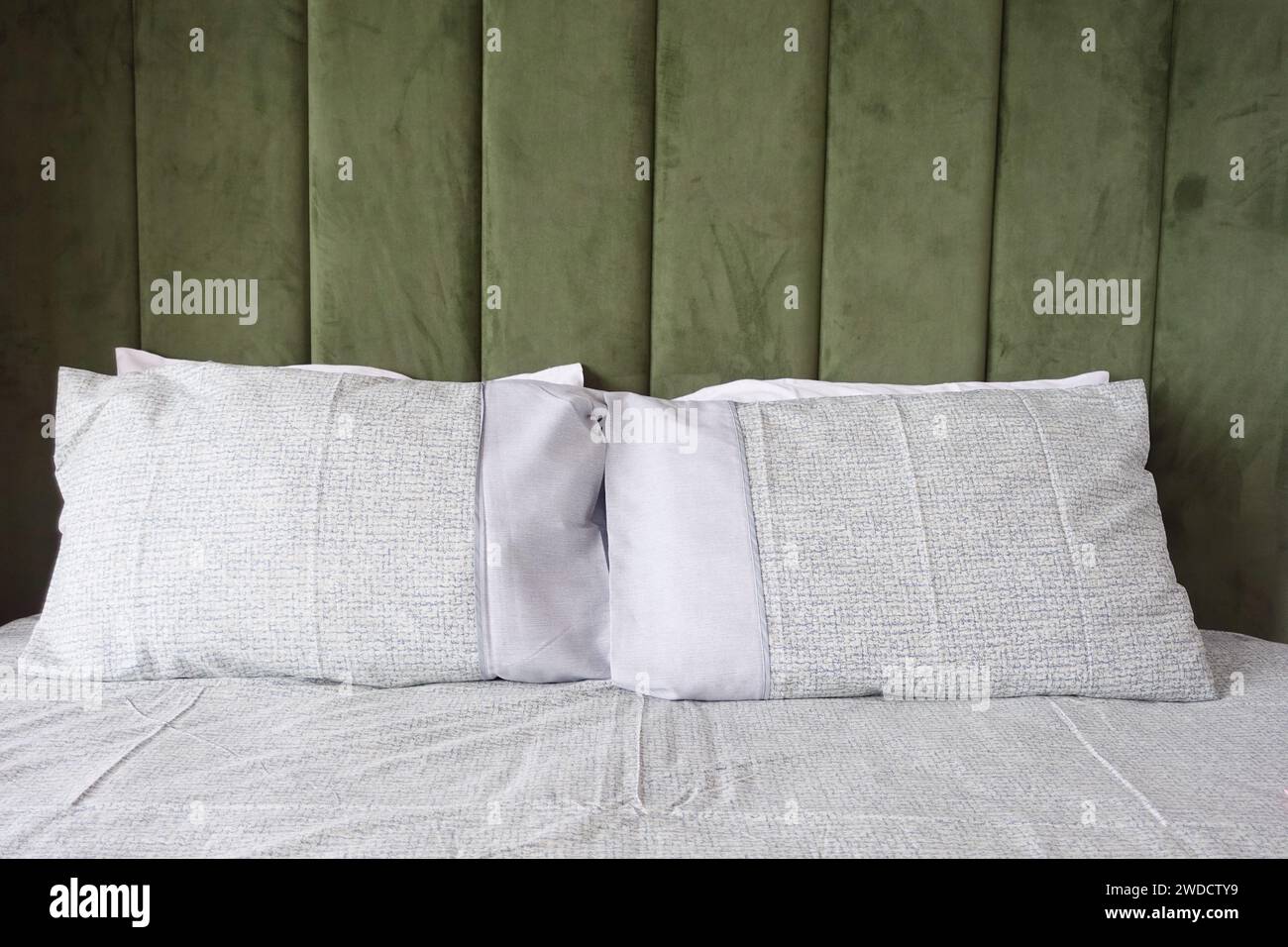 white pillow lined up on bed Stock Photo