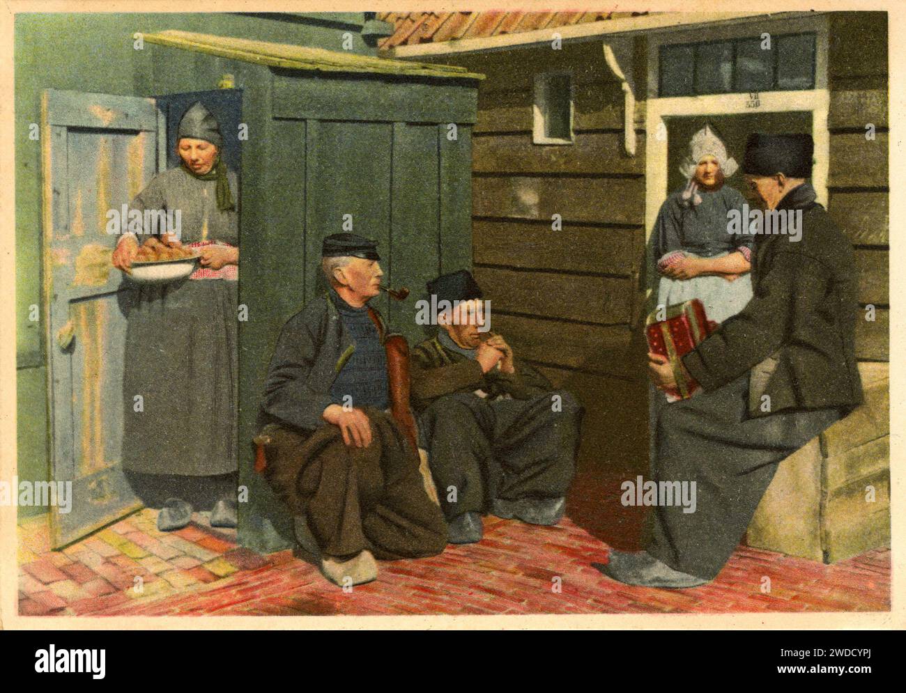 A Bensdorp Chocolate advertisting postcard showing people in traditional Dutch clothing. Stock Photo