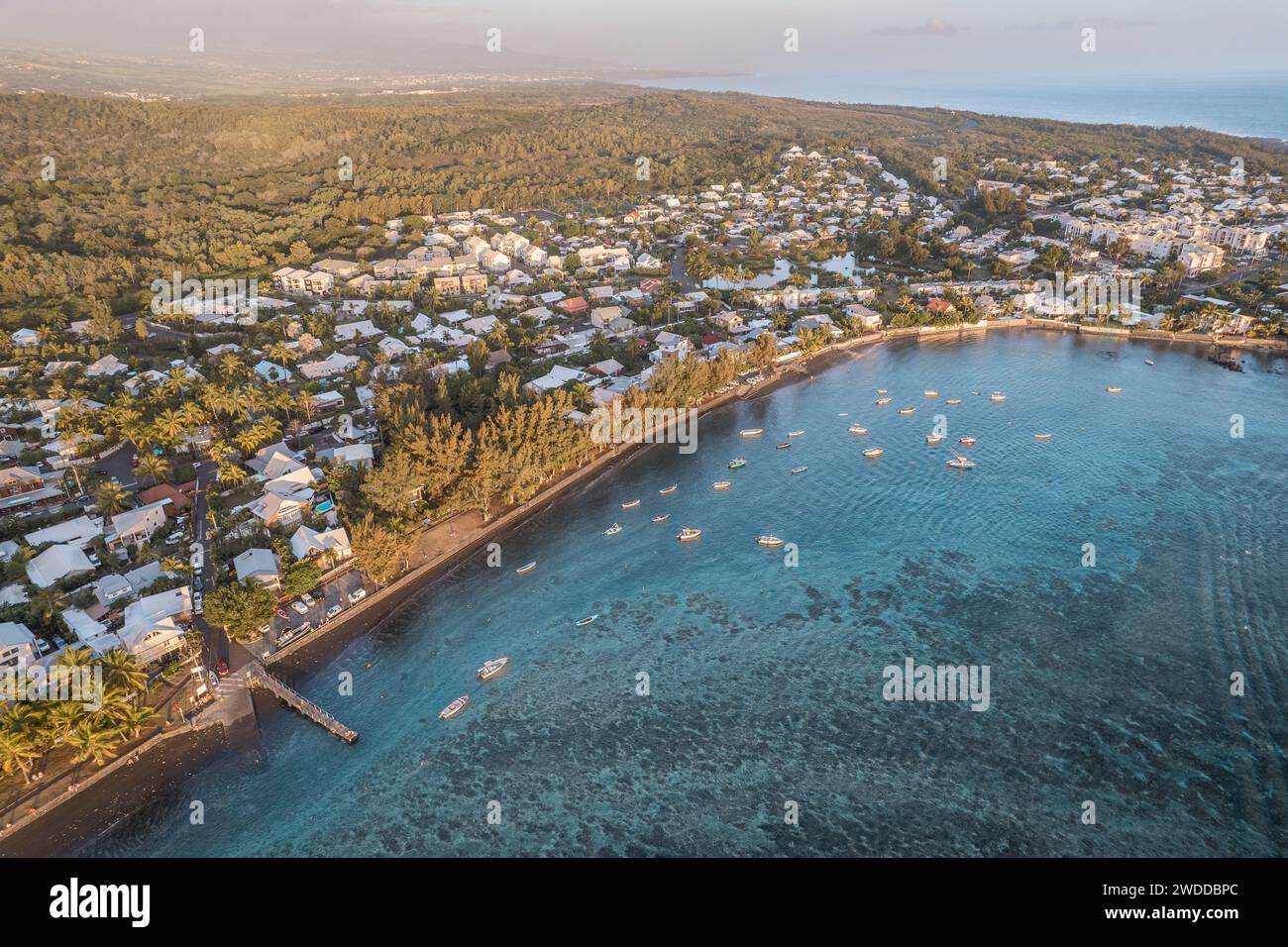 An aerial and scenic view of the Bassin Pirogue, on the beach at Etang-Salé, Reunion Island. Many boats are visible, as well as a tropical lagoon. Stock Photo