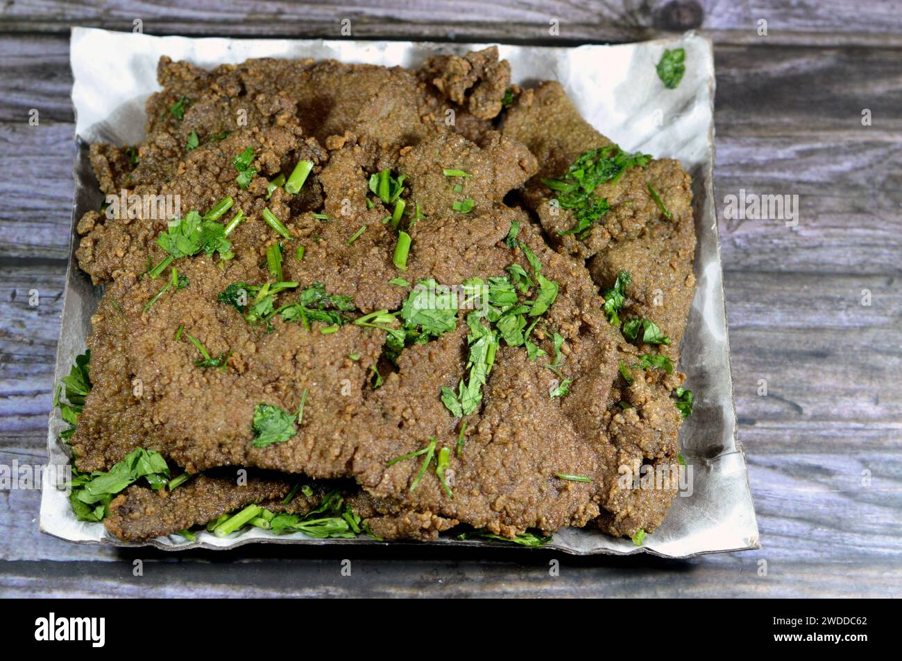 Traditional Arabic deep fried beef liver slices, beef liver covered