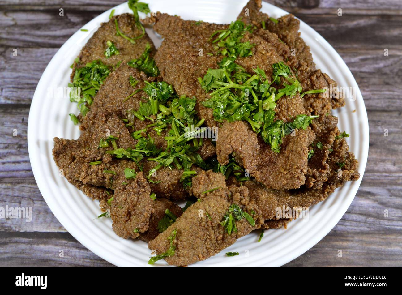 Traditional Arabic deep fried beef liver slices, beef liver covered