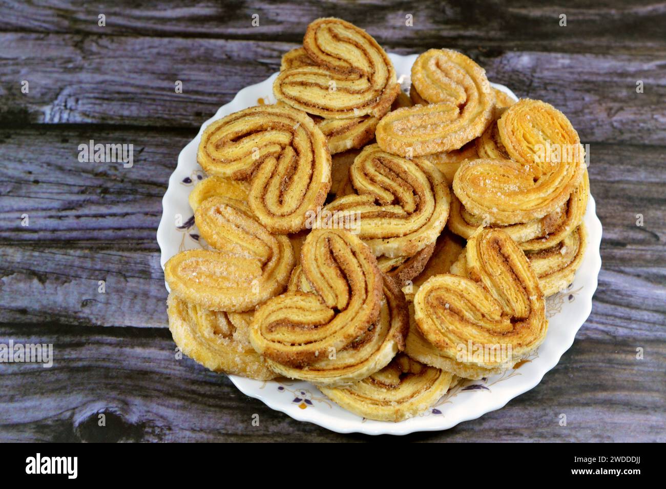 palmier, short for feuille de palmier 'palm tree leaf, French hearts