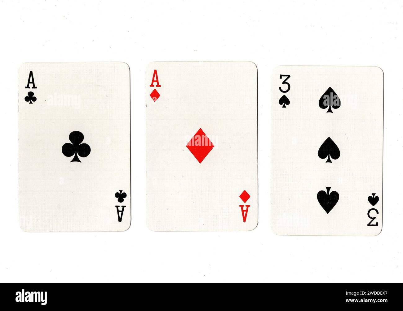 Vintage playing cards showing a pair of aces and a black three isolated