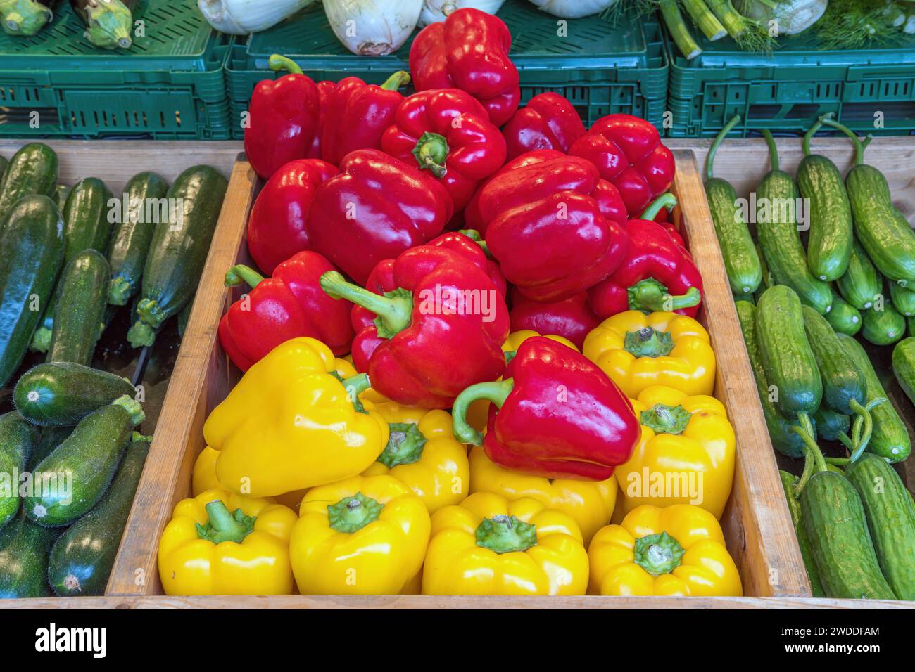 Bell pepper, courgettes and pickles for sale at a market Stock Photo