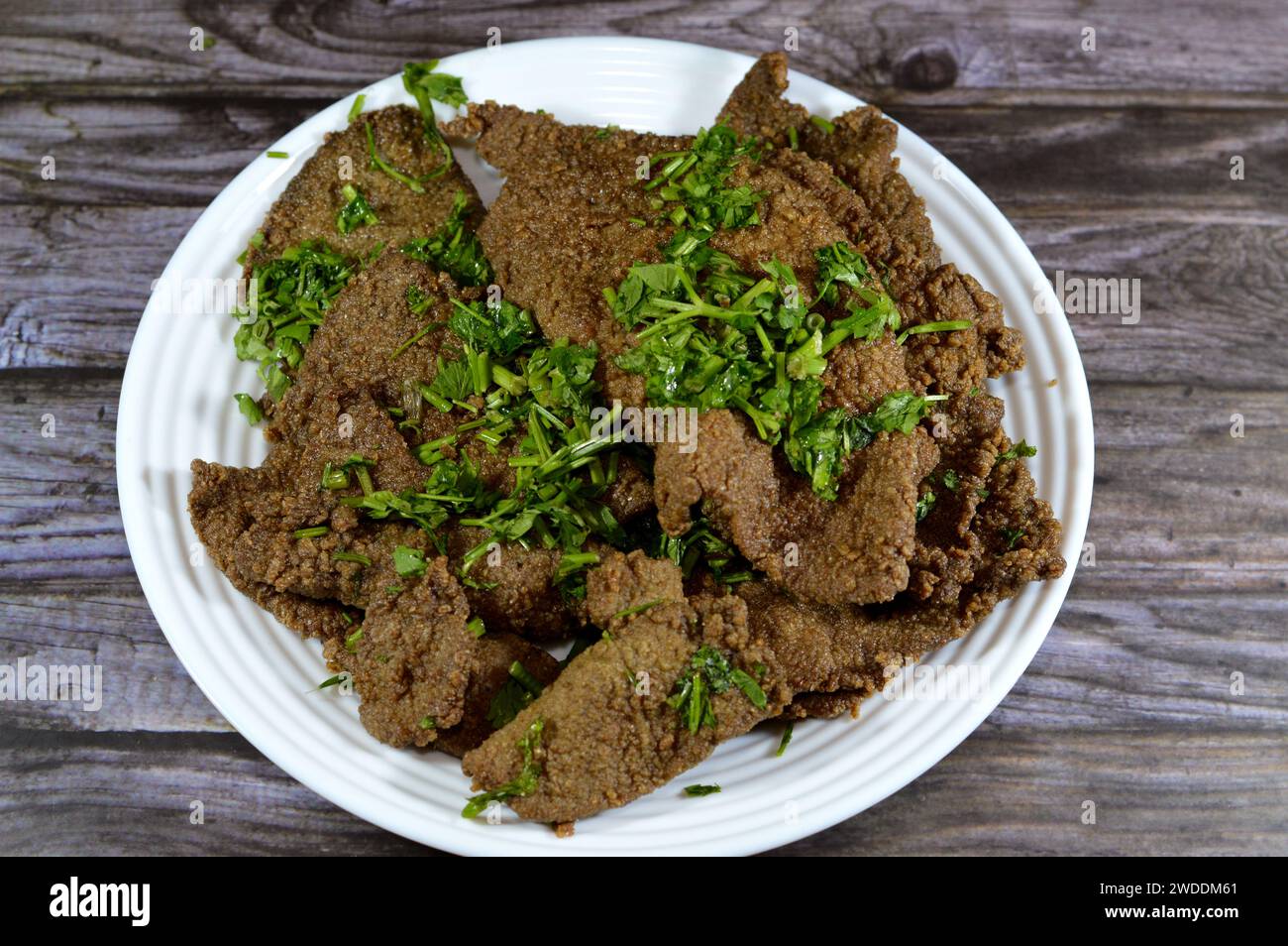 Traditional Arabic deep fried beef liver slices, beef liver covered with wheat bran, (Kebda Bel