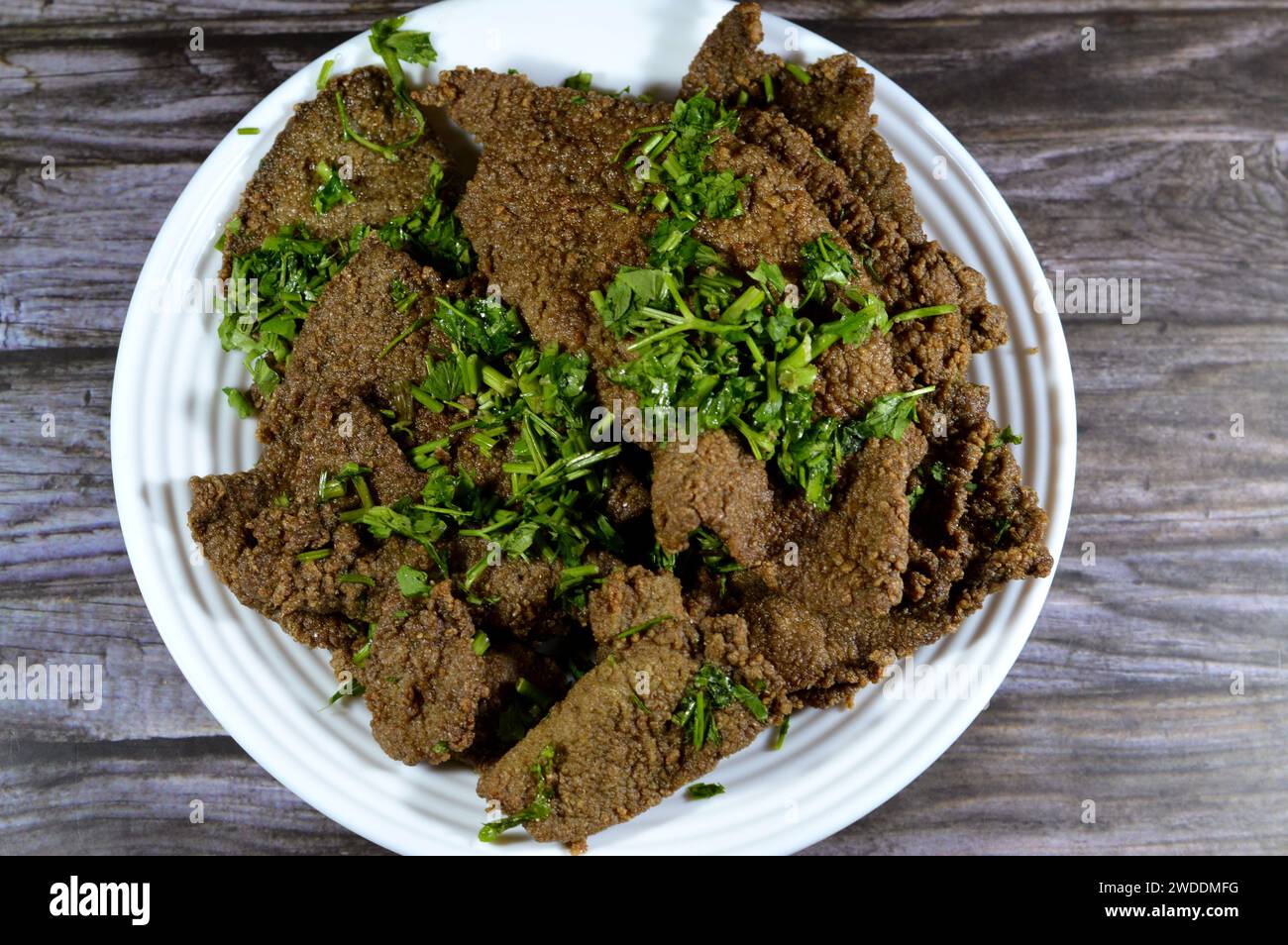 Traditional Arabic deep fried beef liver slices, beef liver covered with wheat bran, (Kebda Bel
