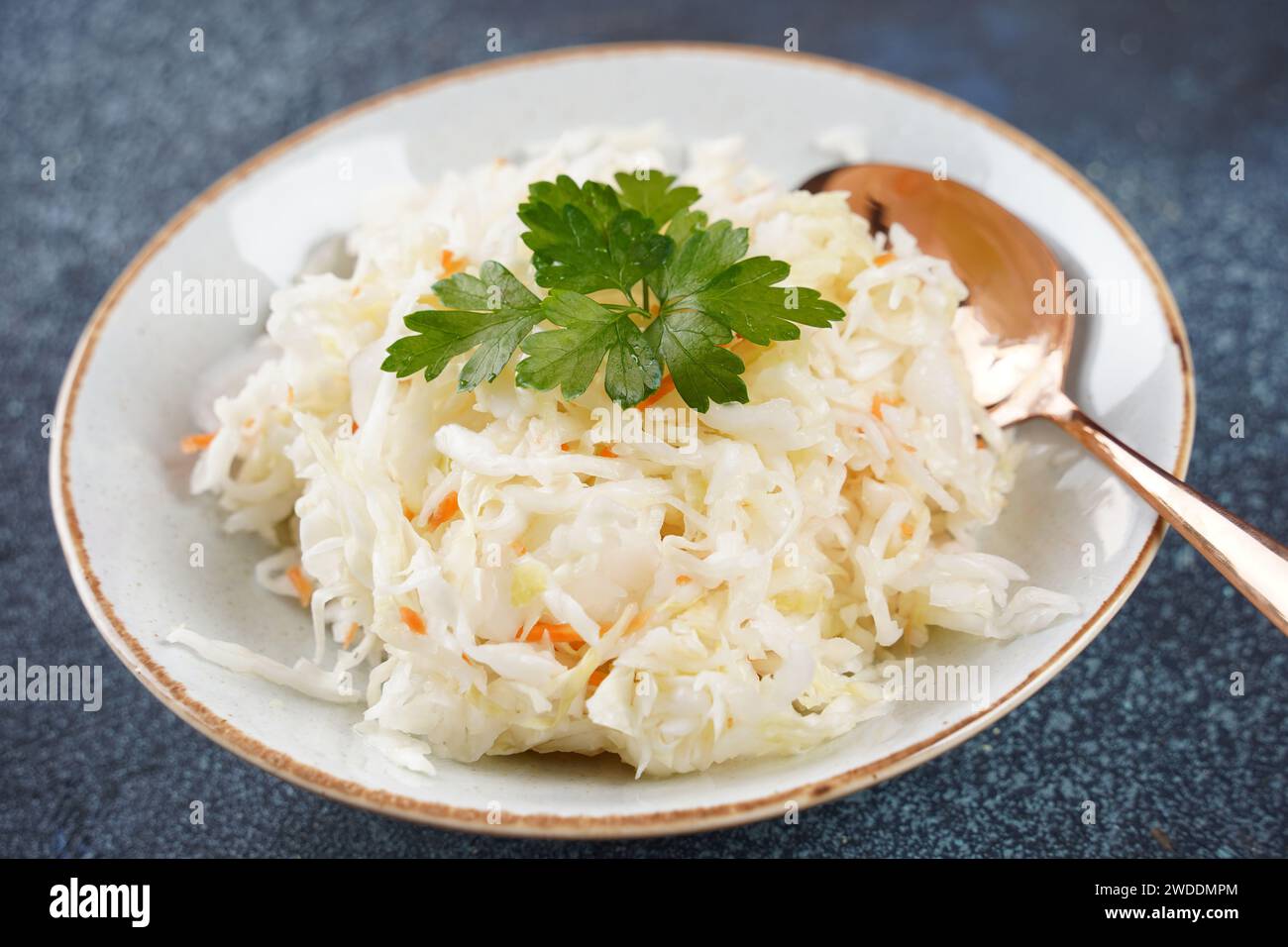 Sauerkraut - fermented cabbage with carrot  in the bowl Stock Photo