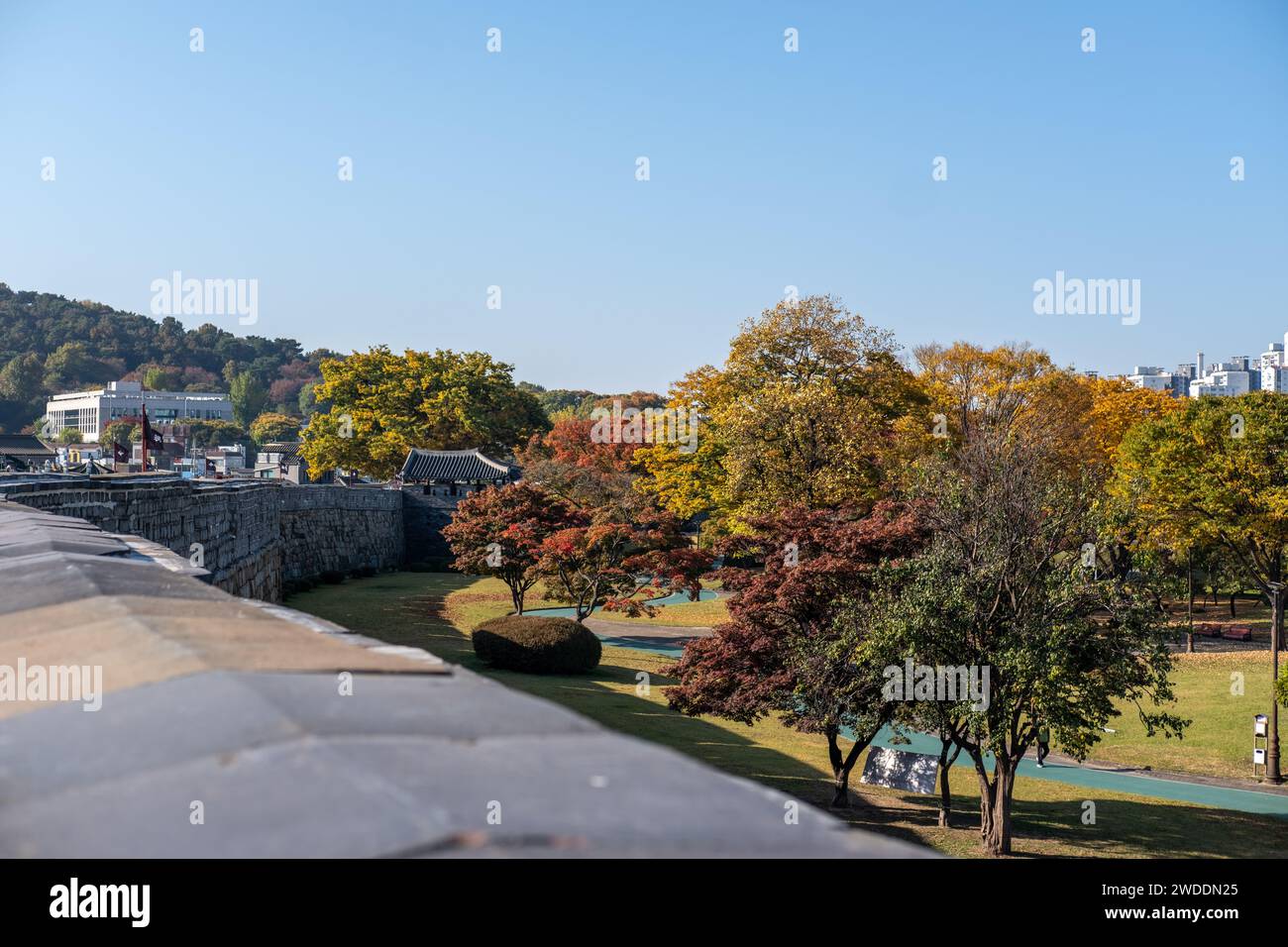 Suwon Hwaseong Fortress Wall, with the park view during autumn. The wall is surrounding the center of Suwon, the provincial capital of Gyeonggi-do, in Stock Photo