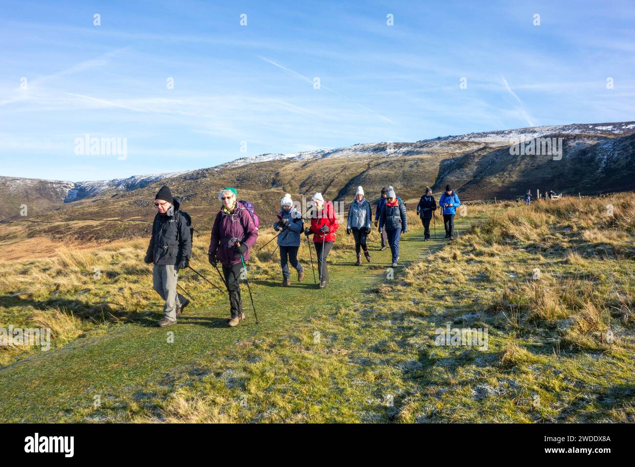 Members of the Sandbach U3A long walking group enjoying rambling in the Peak District hills above the Derbyshire town Hayfield England on Kinder Low Stock Photo