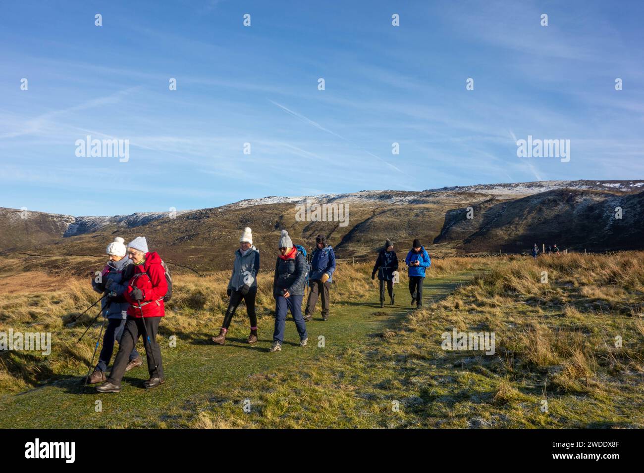 Members of the Sandbach U3A long walking group enjoying rambling in the Peak District hills above the Derbyshire town Hayfield England on Kinder Low Stock Photo