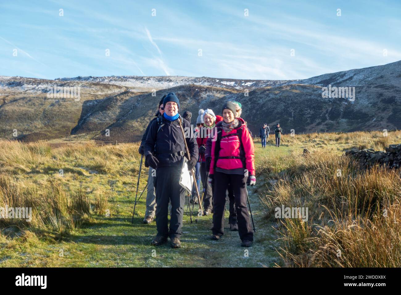 Members of the Sandbach U3A long walking group enjoying rambling in the Peak District hills above the Derbyshire town Hayfield England on Kinder Low Stock Photo