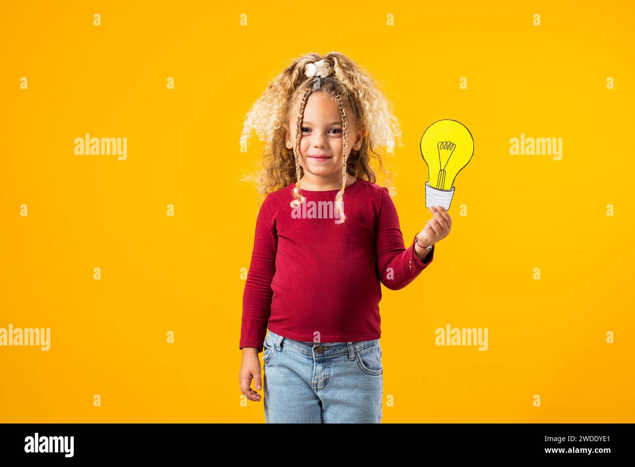 Idea Illumination. Child girl Genius with Paper Bulb.Success
