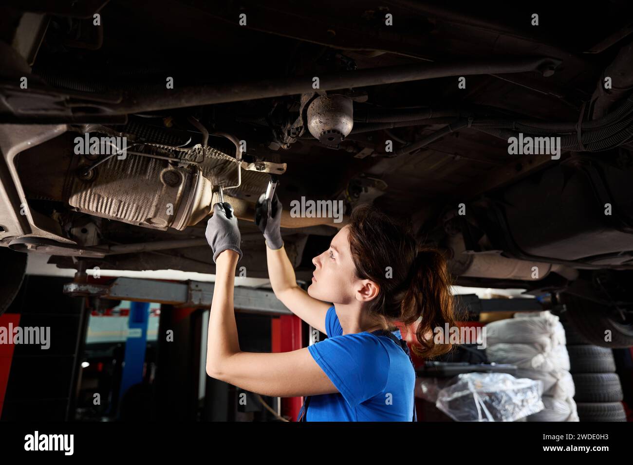 Car is raised on a lift to replace the crankshaft Stock Photo - Alamy