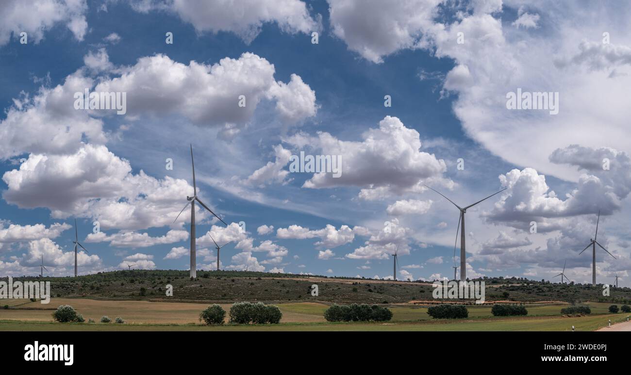 Wind turbines in rural landscape and stunning cloudy sky at the ...