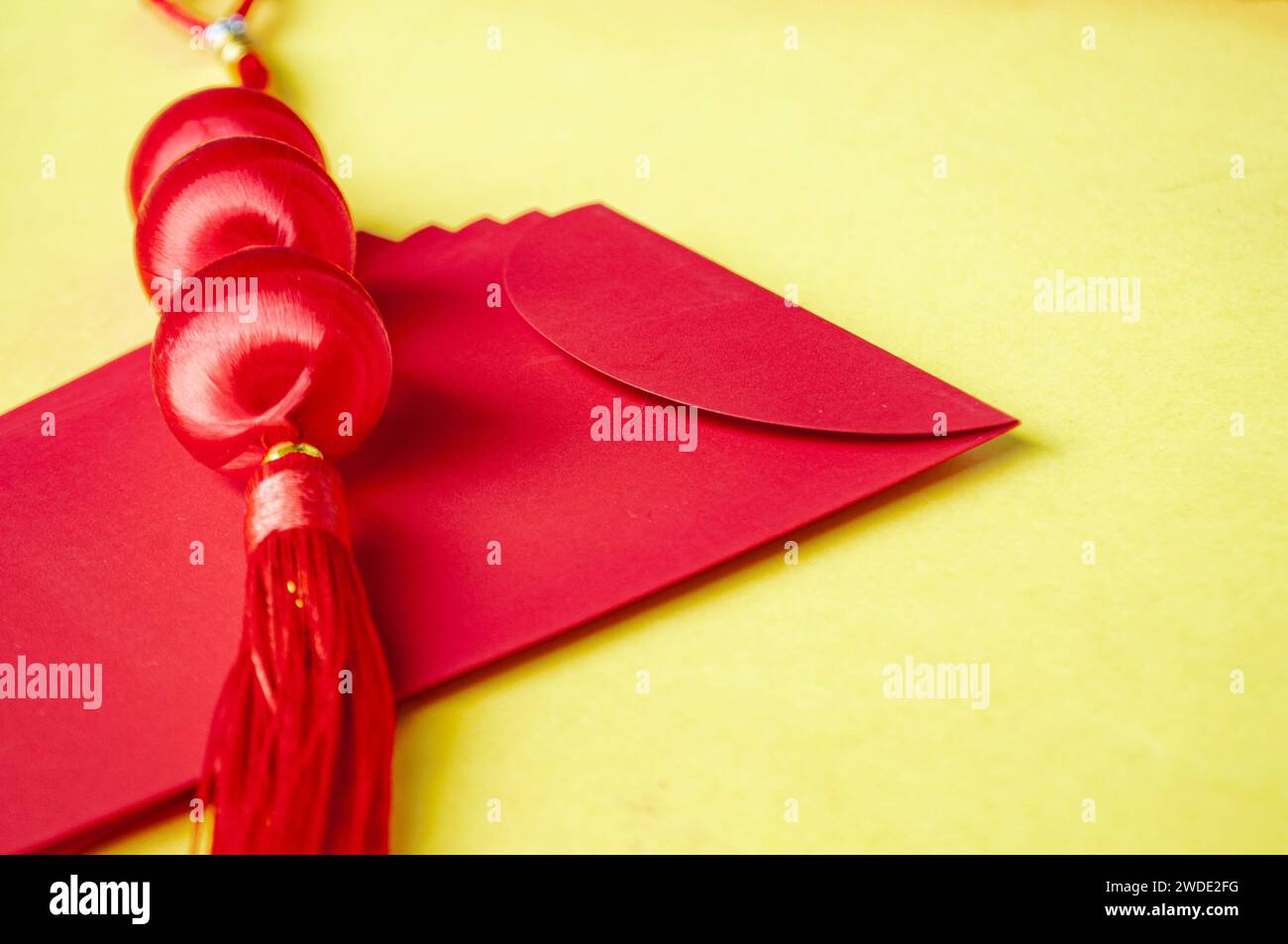 Side view of Chinese New Year red packet with customizable space for text or wishes. Chinese New Year celebration concept Stock Photo